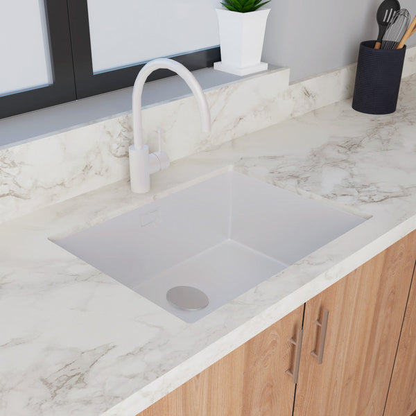 Sleek single bowl stainless steel kitchen sink with a clean white finish and modern design